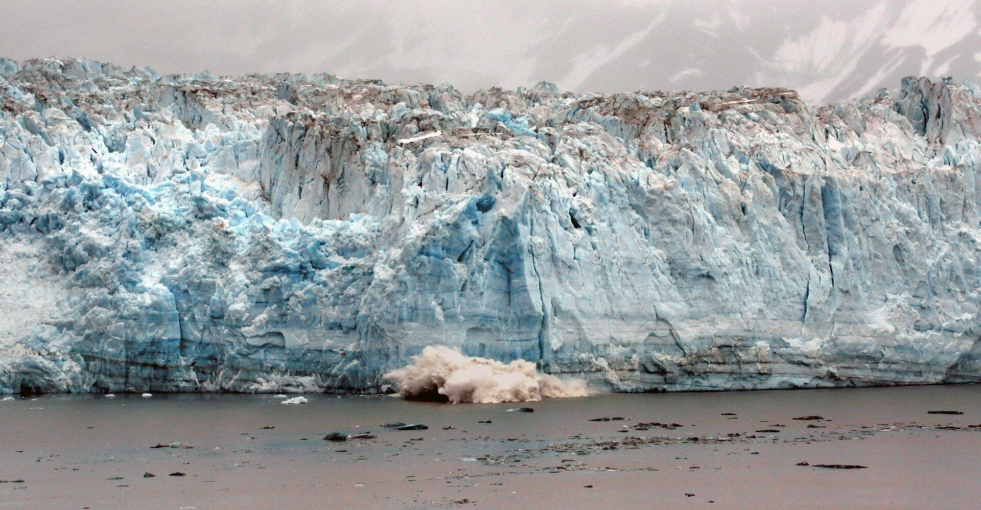 The towering blue-white face of Hubbard Glacier in Alaska