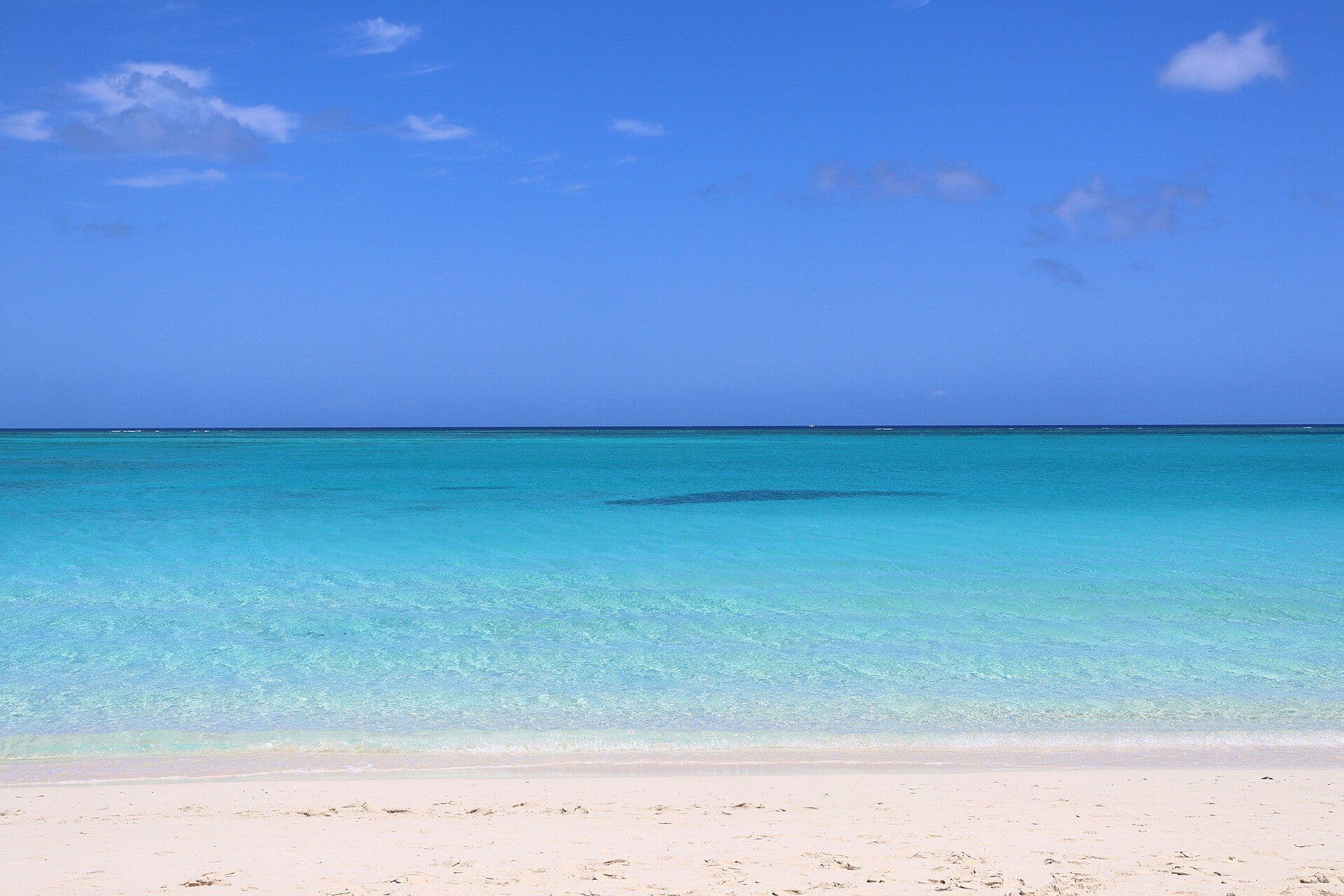 White sand and turquoise water at Grace Bay in the Caribbean